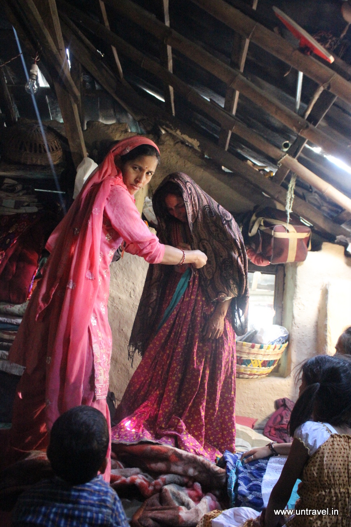 When I went to pass the message to the bride, she was happily chatting with her cousins, but like I knew would happen – the moment she heard that she has been called – she started crying again. Her friend helped her put on the traditional luan-chhari (the gown) – which was passed down from the brides grandmother – and we took the crying, bawling bride to the puja.